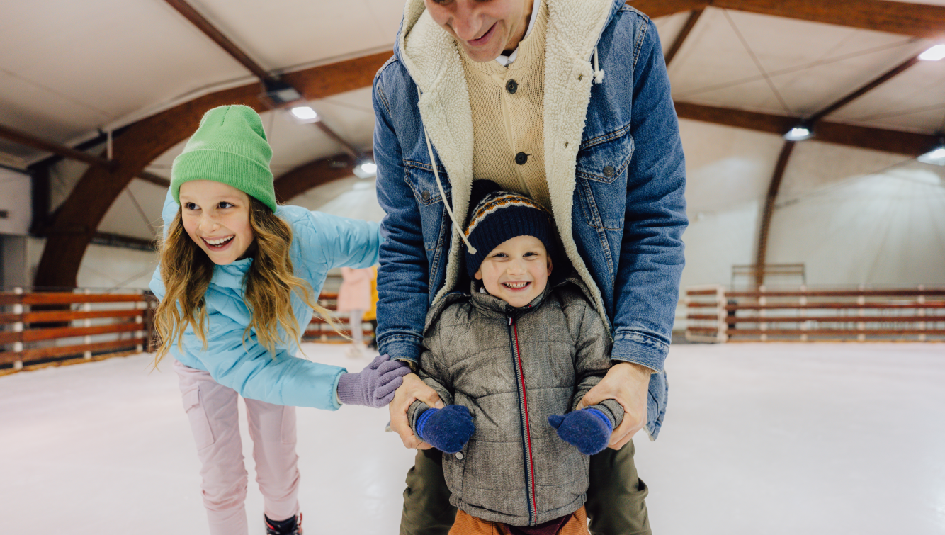 man and kids skating