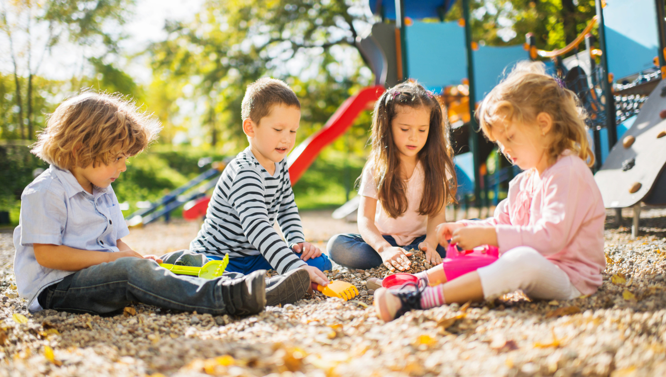 Children playing at a sunny playground.