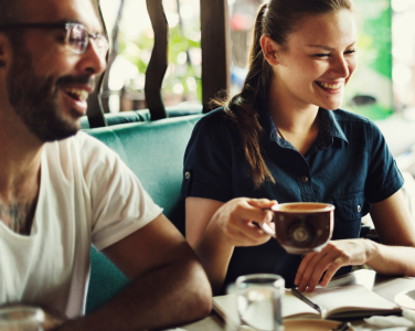 Two people enjoying coffee together.