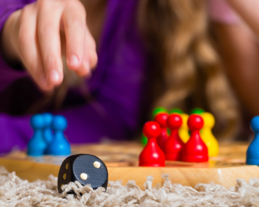 Close-up of a board game with colorful pieces.