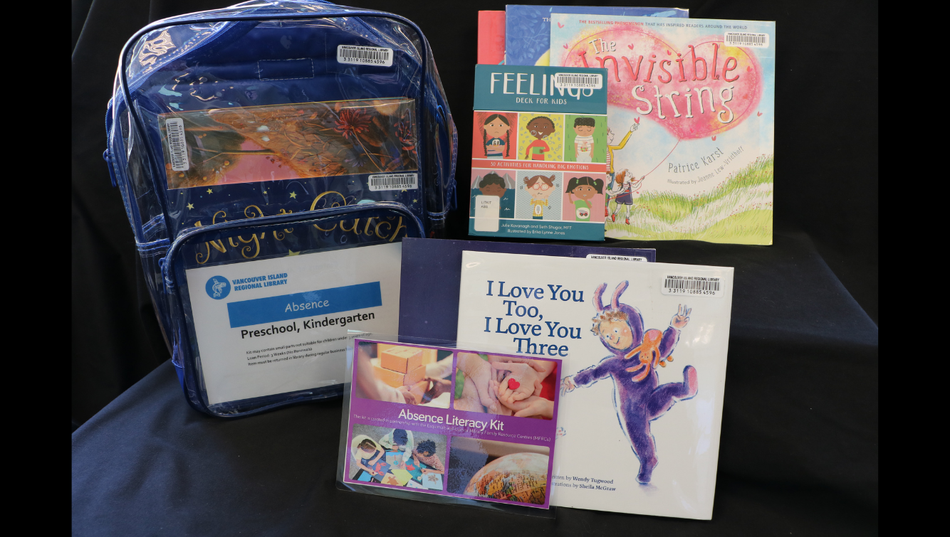 A display of children's books and an educational backpack kit.