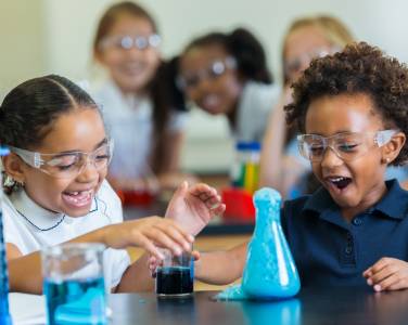 young girls doing a science experiment