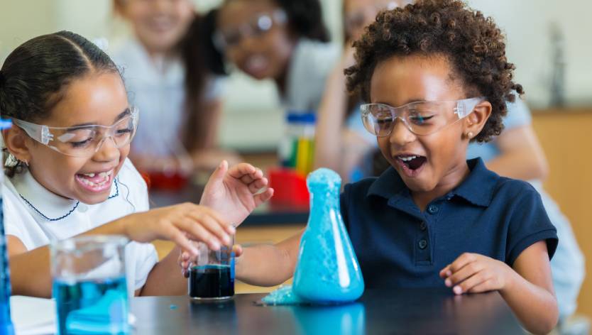 young girls doing a science experiment