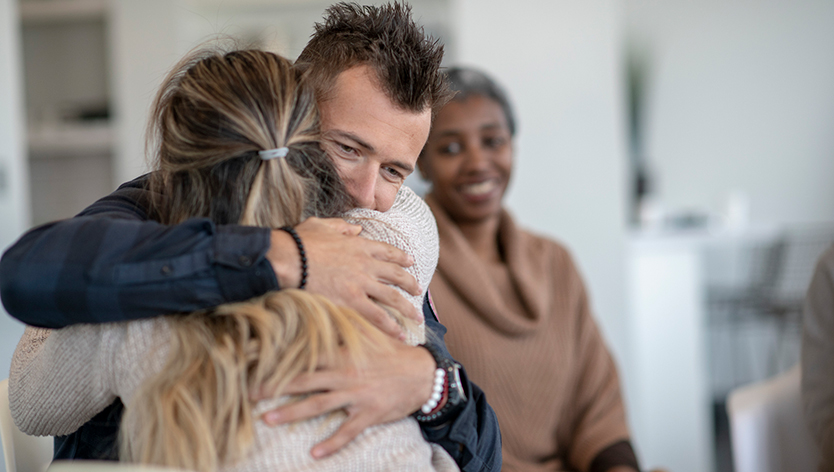 Men hugging a women