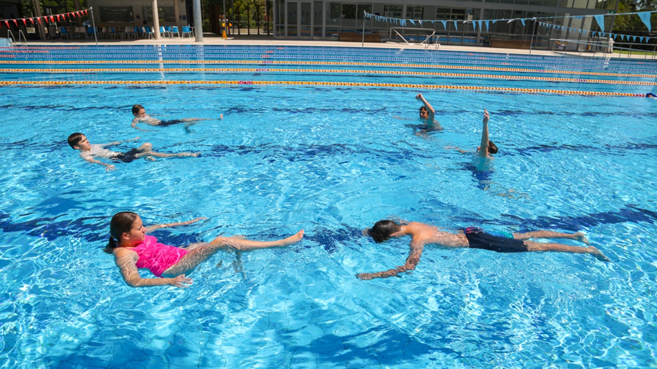 Swimmers practicing skills
