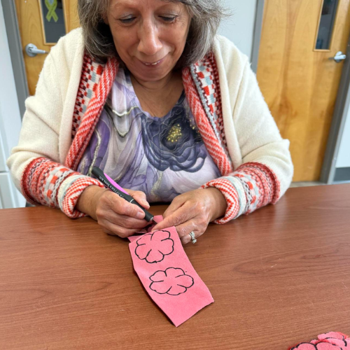 Indigenous Elder, Marlene Joudry, preparing sealskin for the workshop
