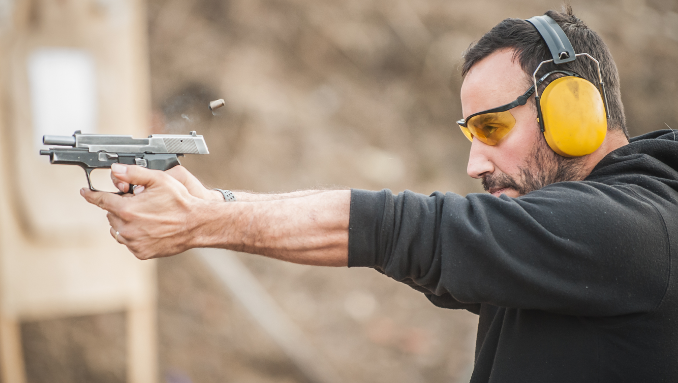 person shooting a gun