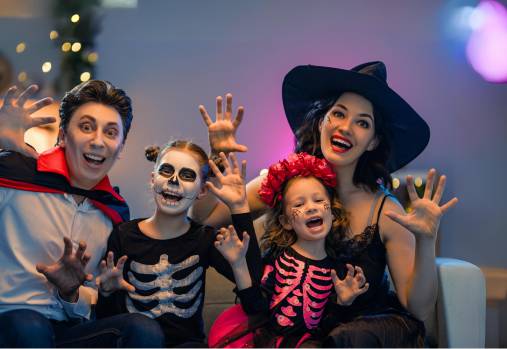 Family dressed in Halloween costumes