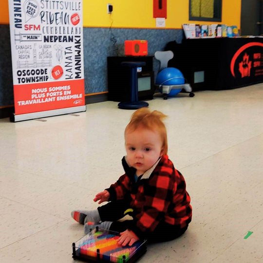 a child in a plaid shirt