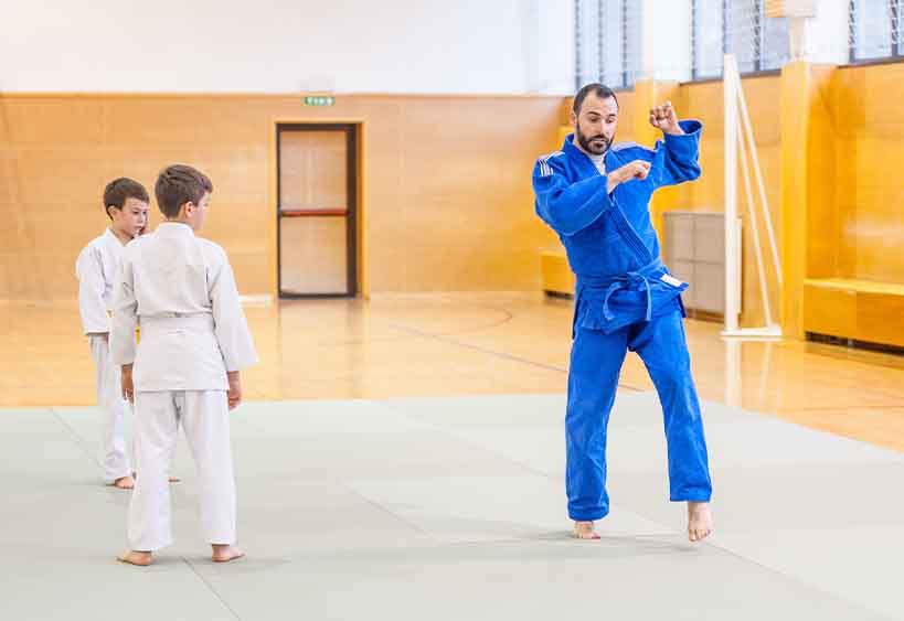 Children having judo class
