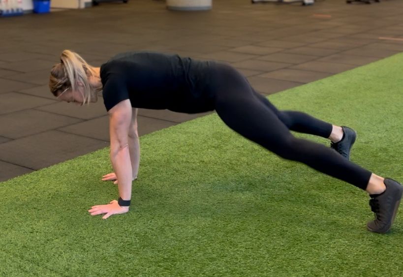 Fitness instructor doing exercise