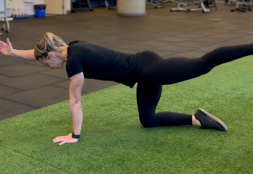Fitness instructor doing exercise