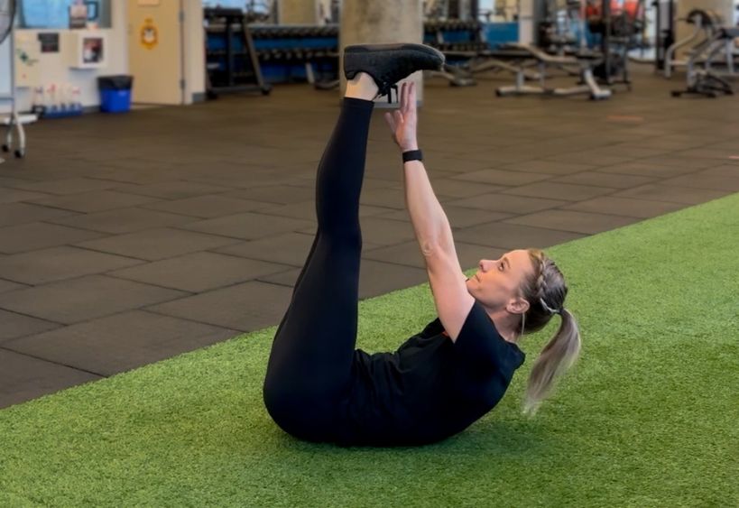 Fitness instructor doing exercise