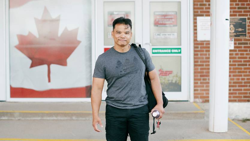 CAF member smiling standing outside gym facility