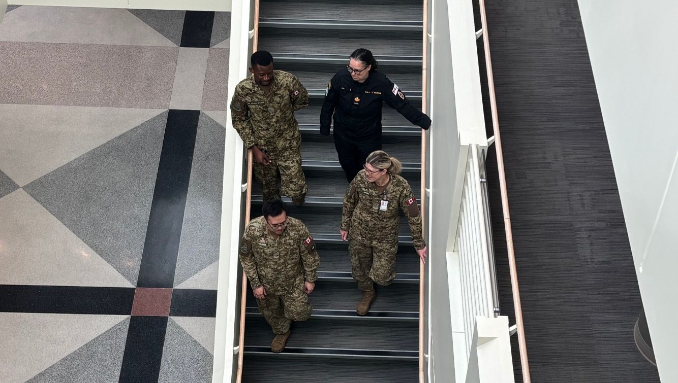 CAF members walking down the stairs