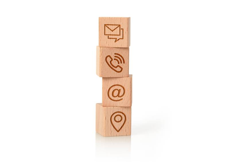 Wooden block cube symbol telephone, email, address and mobile phone. Website page contact us or e-mail marketing concept