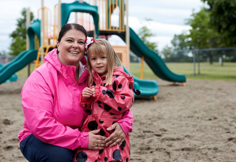 mother and daughter playing in a park 