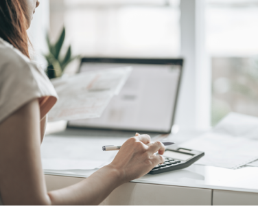woman working on calculator