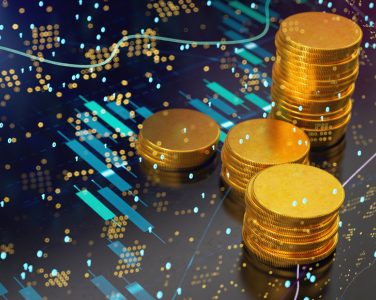 coins over a background with charts