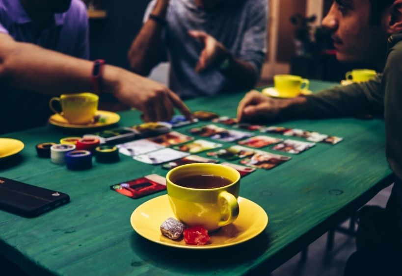 People playing a board game at a restaurant