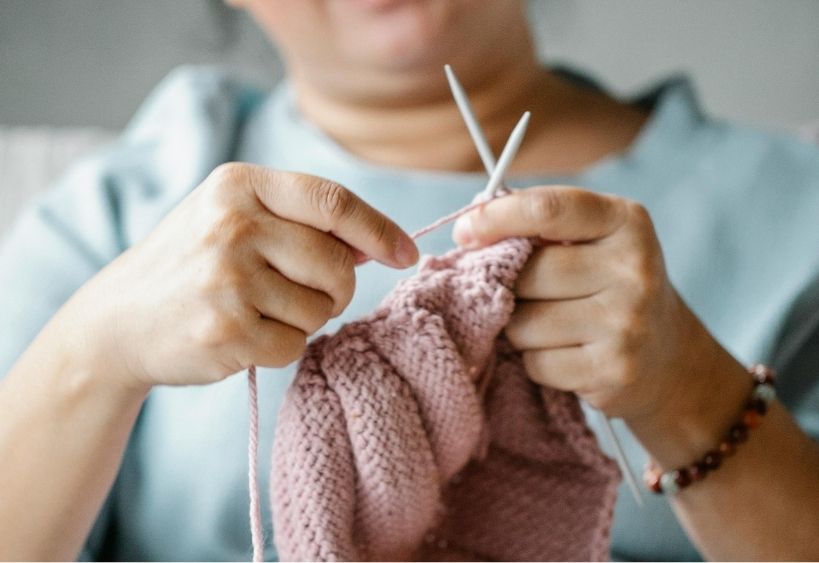 A person knitting