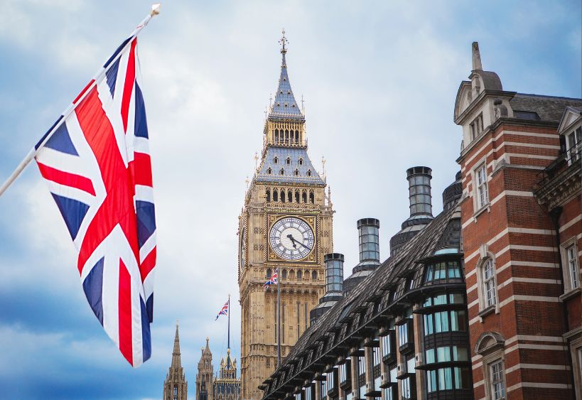 Big Ben in London and the UK flag.