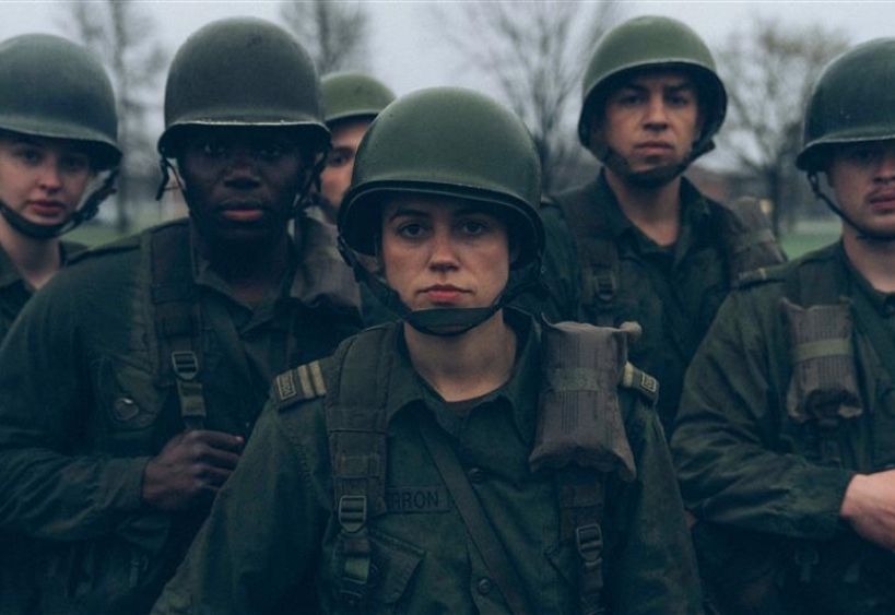 military troops with women soldier standing in forefront 