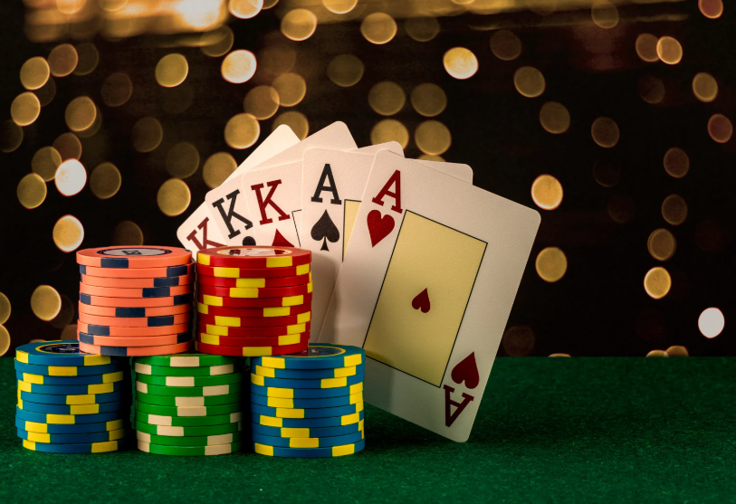 Playing cards with stacks of poker chips