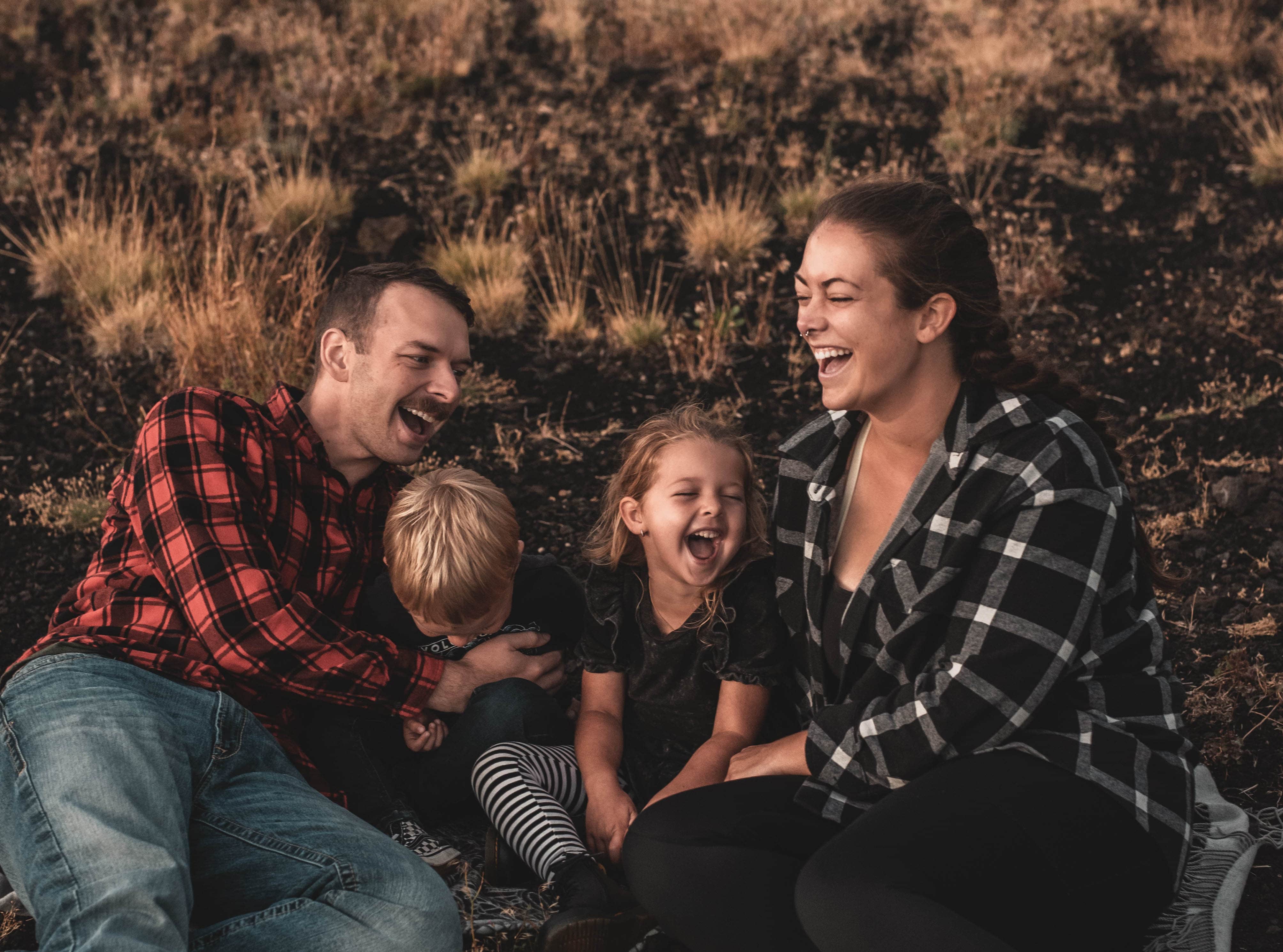 family sitting together laughing