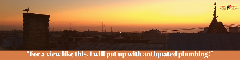 Sunset view of Riga. Text: For a view like this, I will put up with antiquated plumbing!