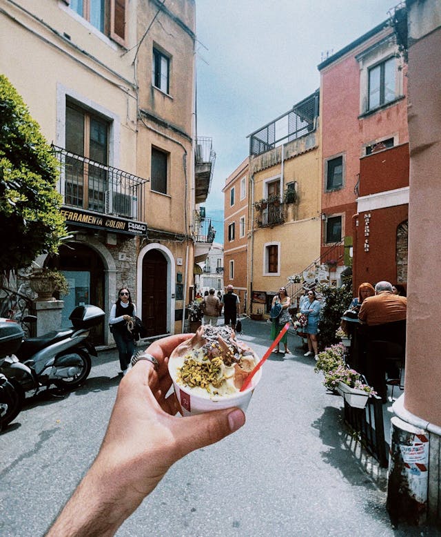 Enjoying Gelato in Picturesque Sicilian Street