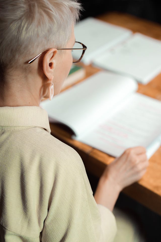 A Woman Reading a Textbook