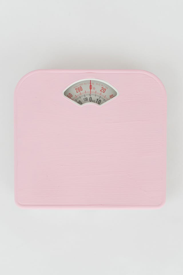 Pink Scale on a White Surface