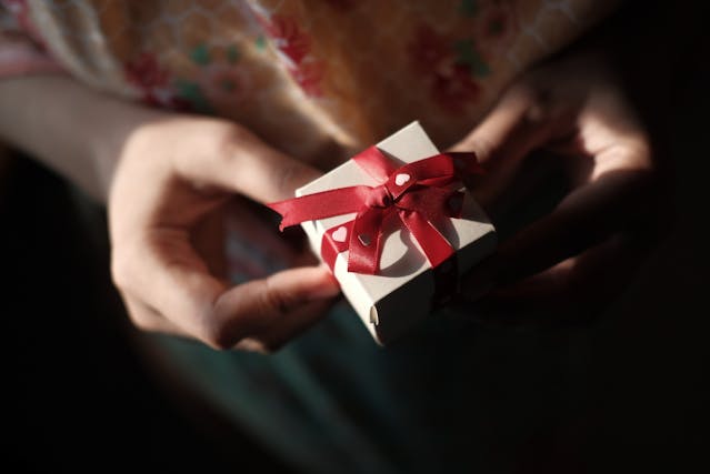 A Person Holding a Gift