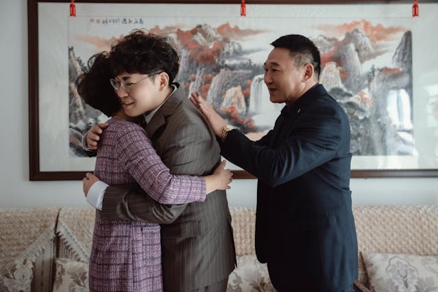 Family with Warm Embrace Indoors