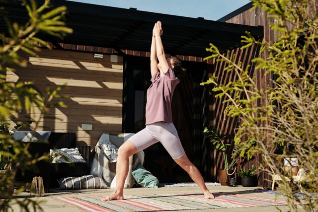 A Woman Working Out on the Porch