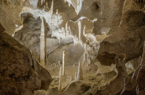 An underground cave with stalactites and stalagmites