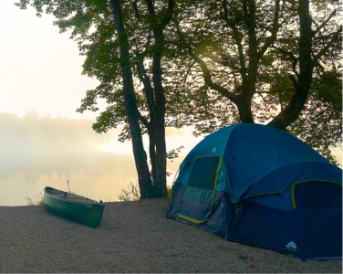 Tent and canoe on a campsite