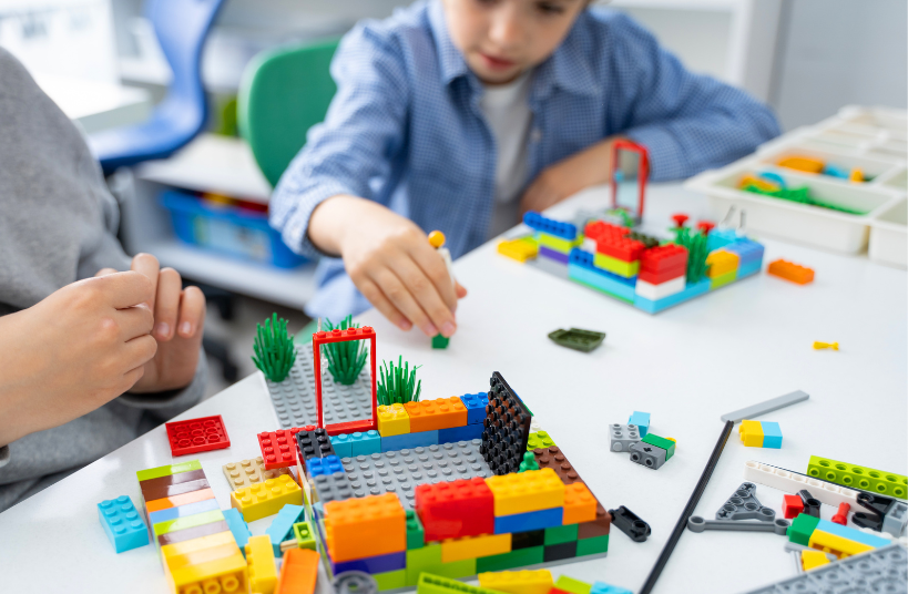 Children Playing with Lego Blocks 