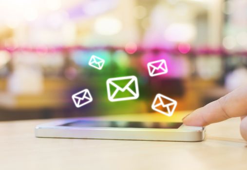 phone with newsletter icons