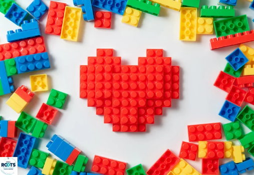 a red LEGO heart in the middle of a pile of LEGO