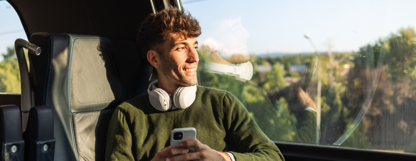 Man on a train looking at the window