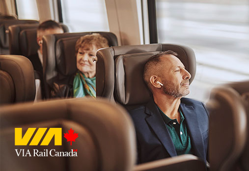 People sitting on train, VIA Rail Canada logo
