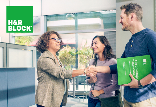 couple shaking hands with tax expert