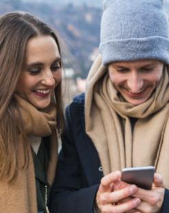 Couple looking at mobile device