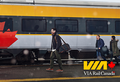 people walking in front of train, VIA logo