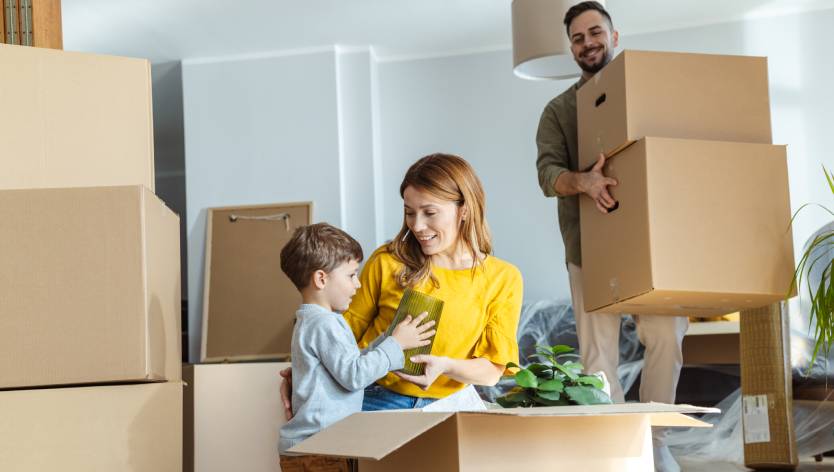 Family and moving boxes
