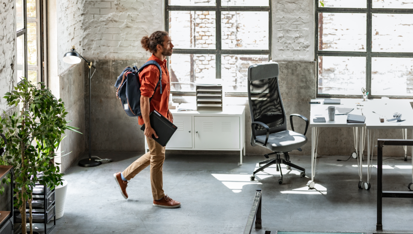 Man walking into an office space