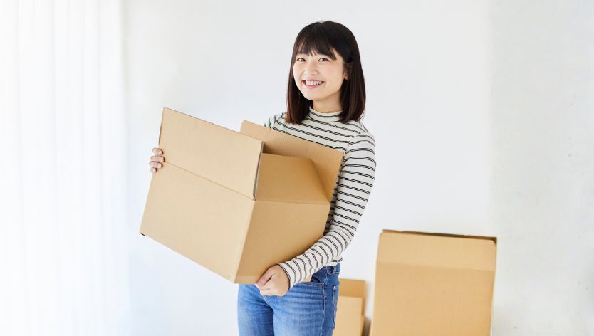 Woman moving boxes
