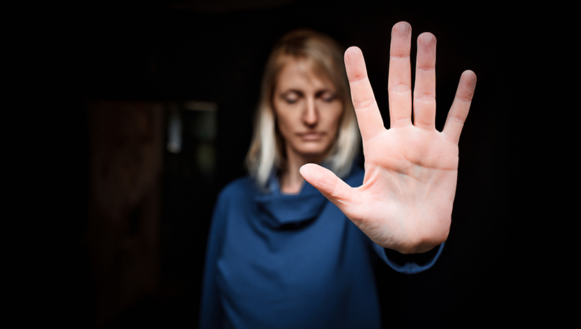 Woman making a stop sign with her hand
